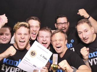 Employees are delighted to win first prize in an internal competition and cheer for the camera. Team spirit.