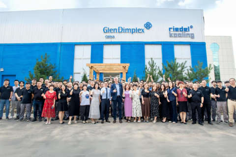 Picture of the building at the Glen Dimplex site in Shenyang, China. All employees seen in front of the building.